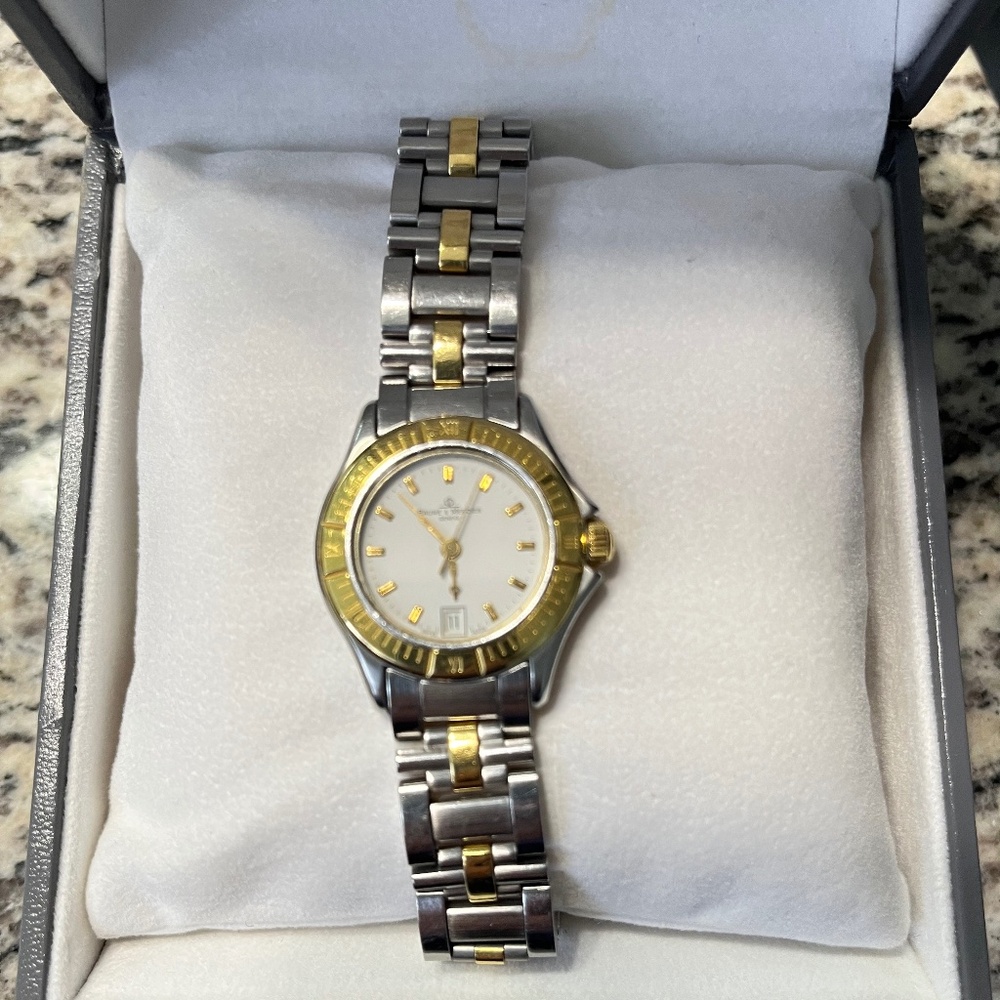 BAUME & MERCIER Ladies stainless steel and 18k yellow gold quartz wristwatch.